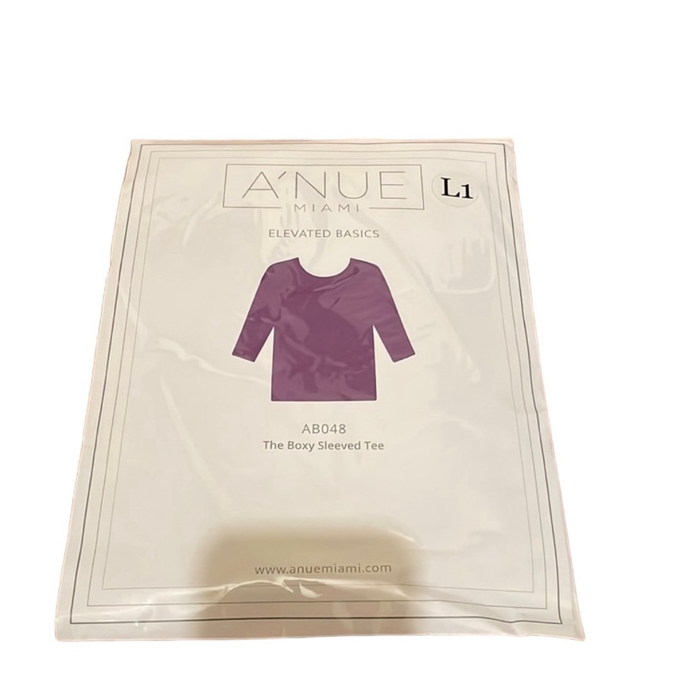 A’nue Miami Boxy 3/4 sleeved tee
in Orchid (purple). Size LI (XL) NWT